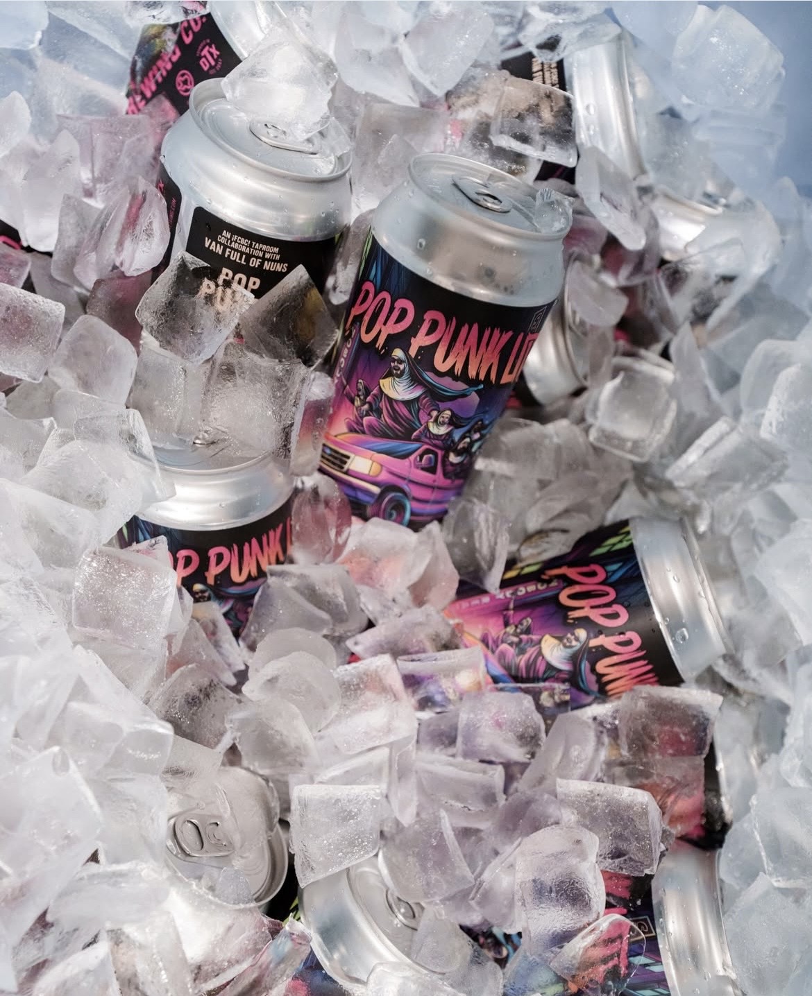 Pop Punk Lite collaboration beer can with Van Full of Nuns displayed in a cooler full of ice at Four Corners Brewing Co., promoting its availability during the April 17 concert event.