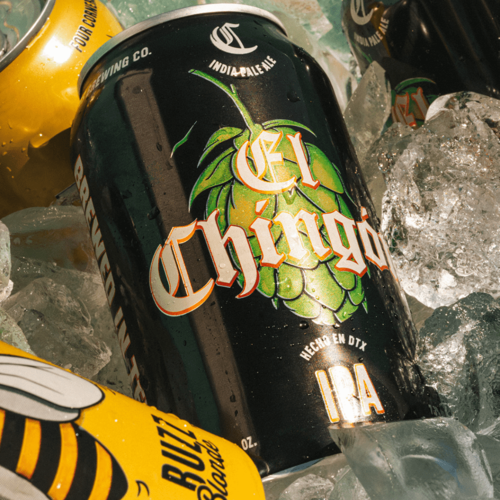 Close-up of Four Corners El Chingón IPA can on ice with Local Buzz Honey Blonde visible in the background
