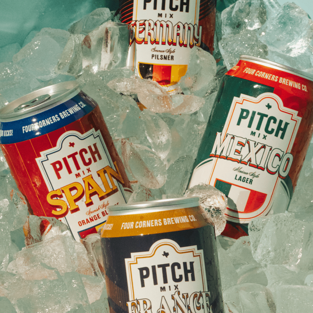 Four Corners Brewing Co. Pitch Mix variety pack cans on ice — Spain Spanish Style Orange Blonde, Germany German Style Pilsner, Mexico Mexican Style Lager, and France French Style Witbier